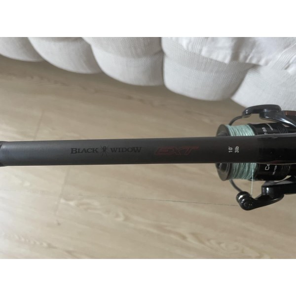 BLACK MAGIC & OKUMA - Ensemble Canne Black Widow Ext 31 lb (2 brins) 80-110G + Moulinet Okuma Ceymar CXT-55